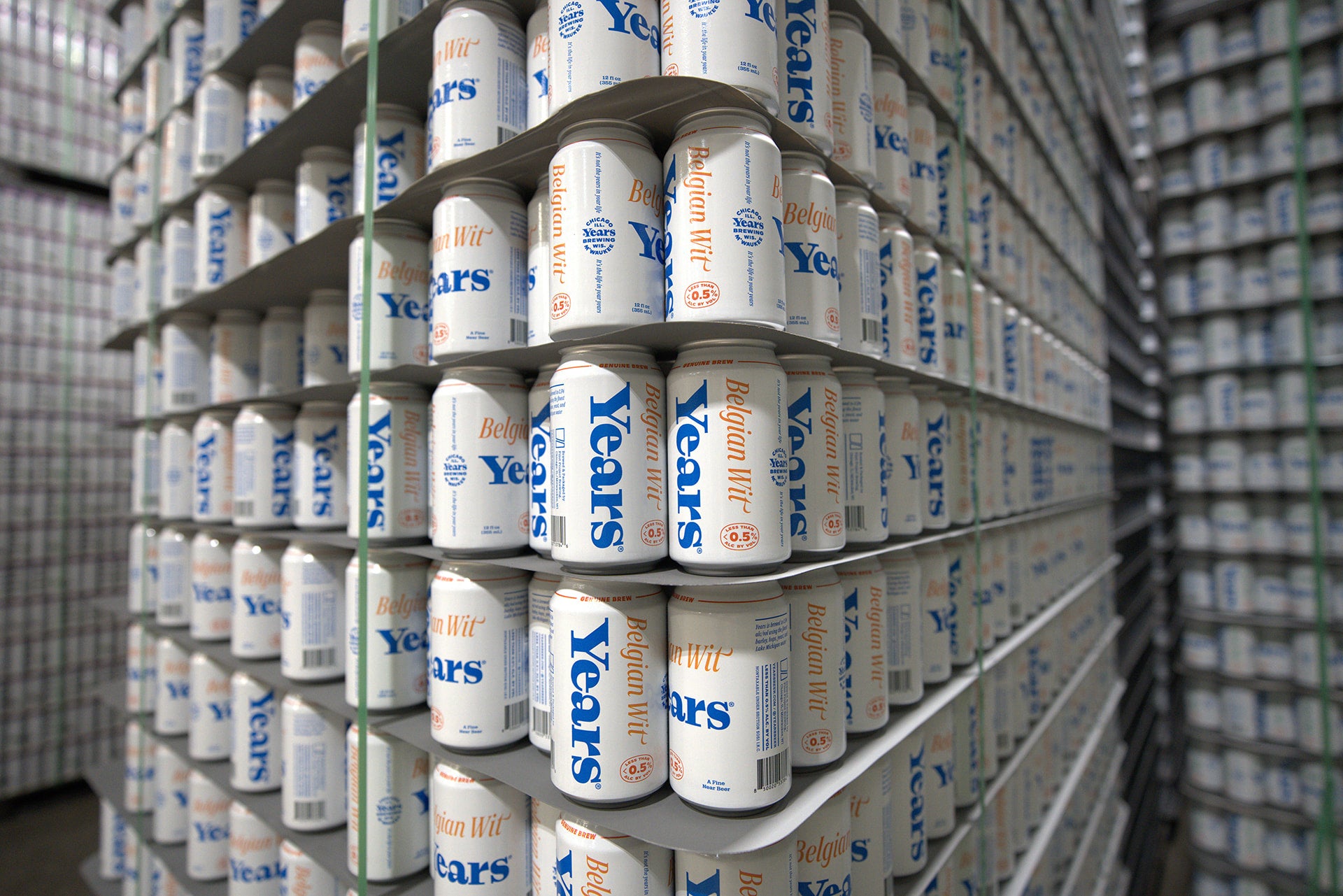 Stacks of 'Years' beer cans in a warehouse setting